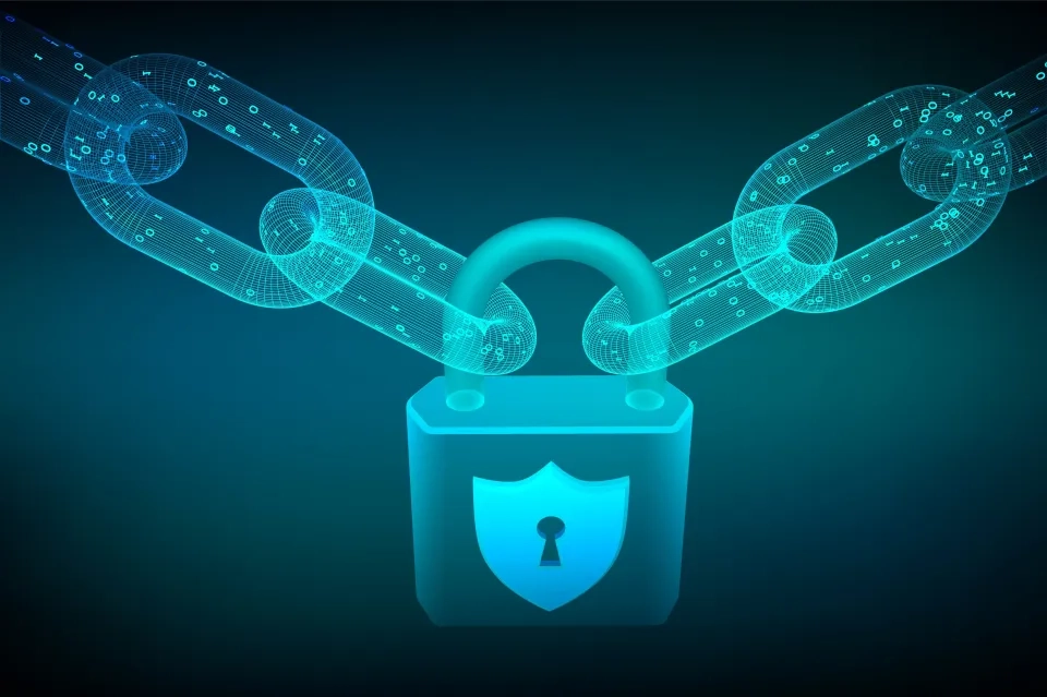 A glowing digital padlock with a shield and keyhole is connected to two blockchain-style chains, symbolising cybersecurity and data protection, on a dark blue gradient background.